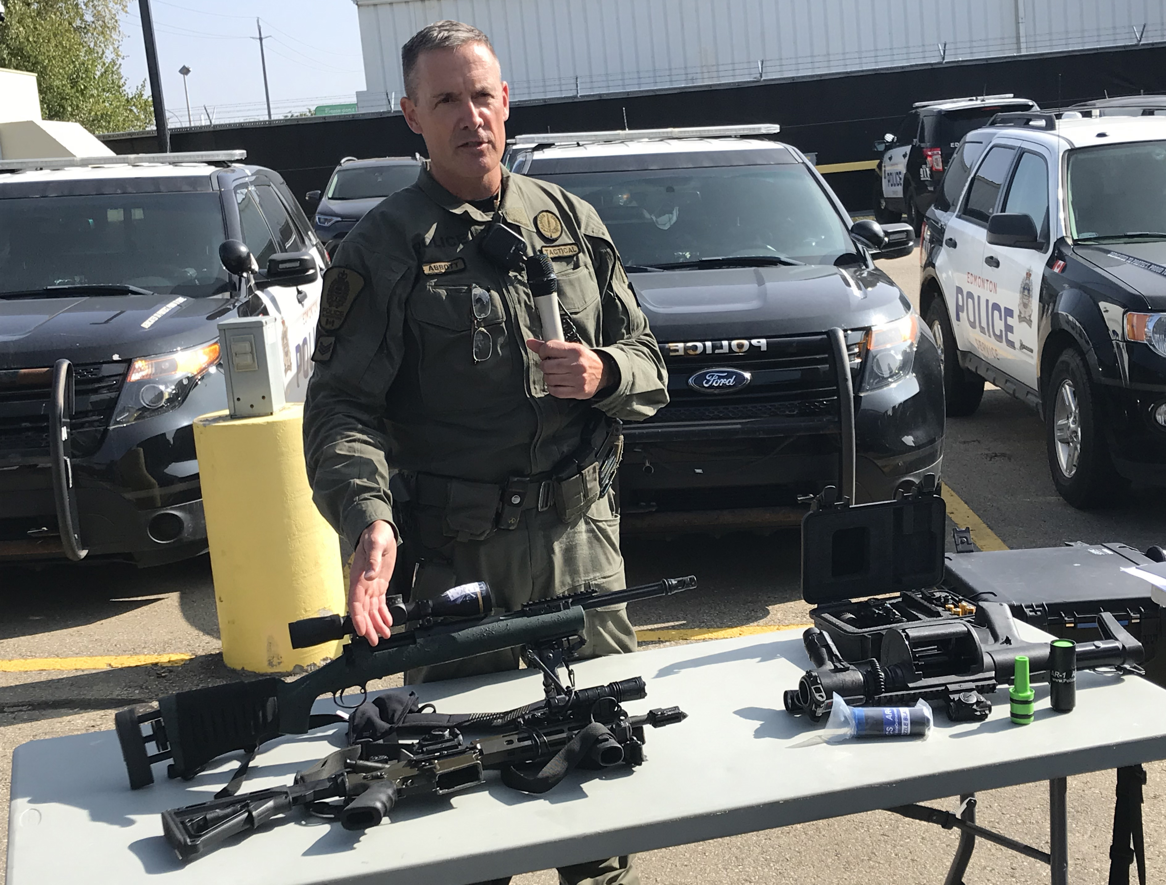 EPS tactical officer with a sniper rifle and less-lethal gear